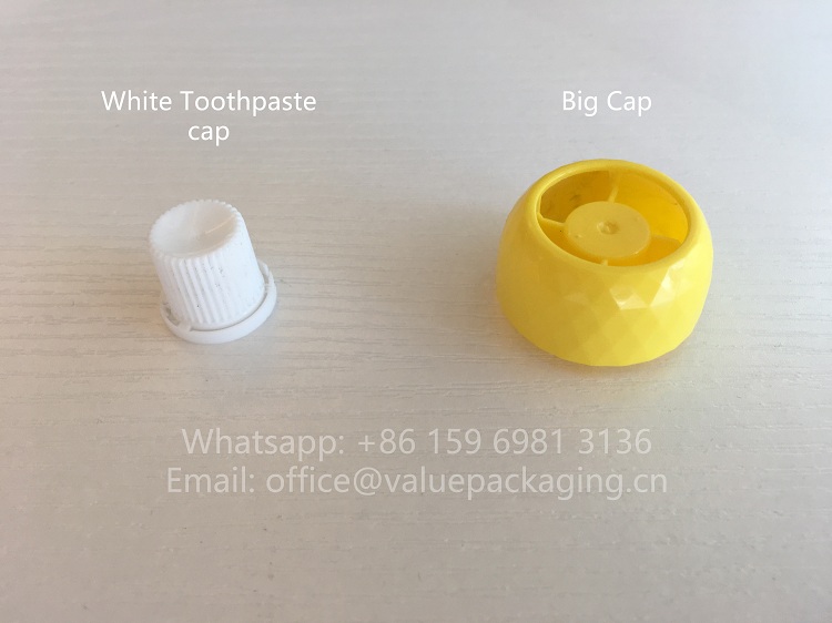 anti-swallow-bag-cap-vs-normal-toothpaste-cap