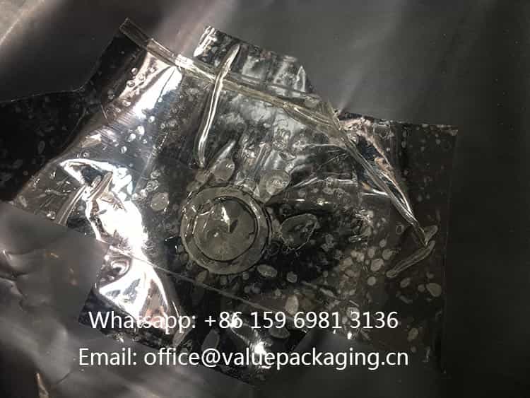 adhesive-tape-over-degassing-valve-on-coffee-bag