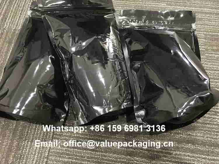 PET12-VMPET12-LDPE-glossy-black-coffee-bags-after-drop-tests-wm-min
