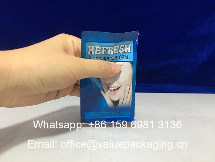 R056-Printed-aluminum-foil-roll-for-mouth-wash-products-20ml-3-sides-sealed-sachet 